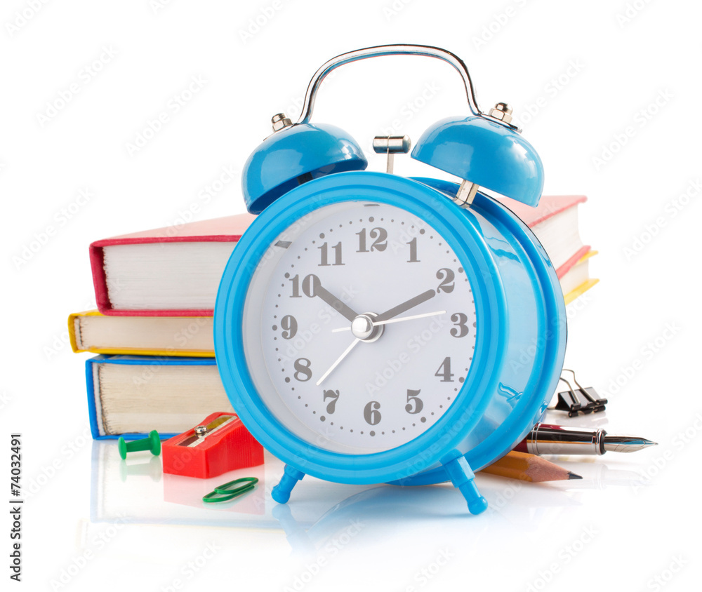 Wall mural alarm clock and school supplies  on white