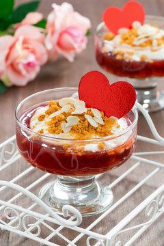 Dessert with jam and whipped cream for Valentine's Day, vertical