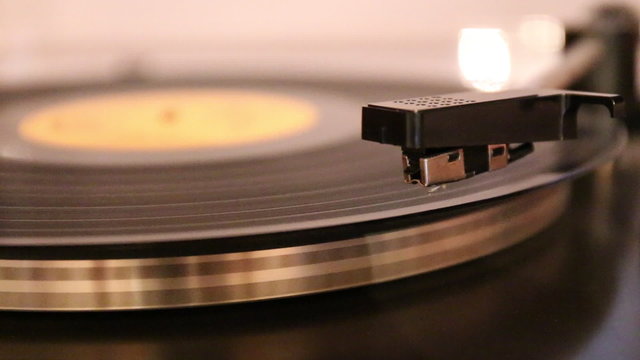 Video with running old gramophone turntable with disc and needle