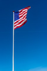 American flag on the blue sky