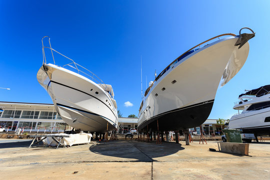 Fototapeta Luxury yacht beached for annual service and repair
