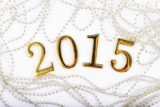 gold figures of the new 2015 year on a white background
