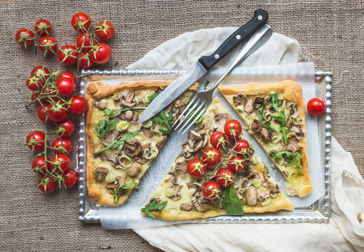 Ristic mushroom (fungi) square pizza with cherry tomatoes and ar
