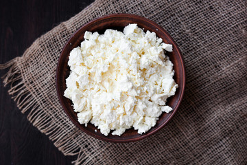 Delicious homemade cottage cheese on the wooden table