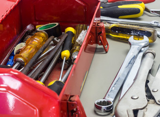 Well used old tools and red tool box