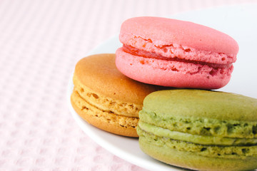 Tasty colorful macaroon on a plate