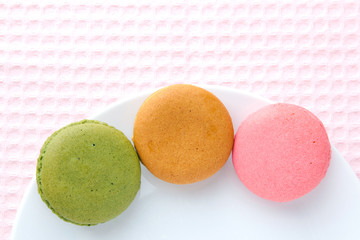 Tasty colorful macaroon on a plate
