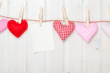 Fototapeta premium Photo frame and valentines day toy hearts