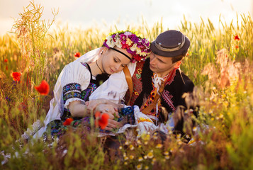 Couple in love with traditional folk costumes