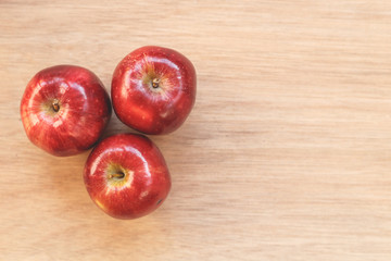 Red apple on wood