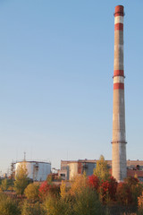 Fototapeta na wymiar smoke stack on the fabric in Russia, autumn landscape