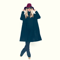 Happy Glamorous lady in a black coat and hat.