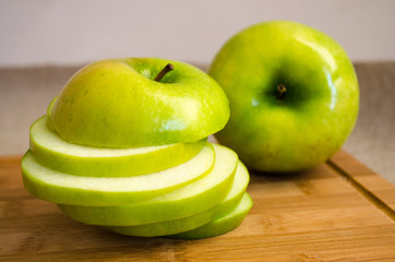 Apple circles on a wooden chopping board