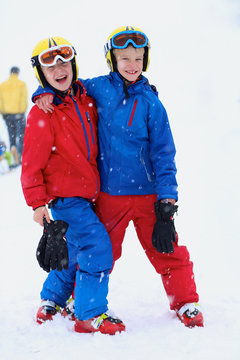 Two brothers enjoying winter ski vacation
