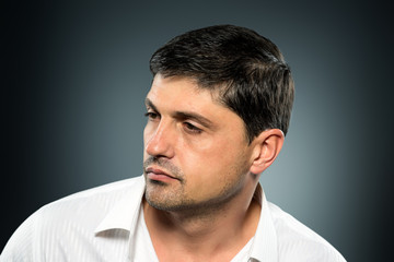 Obraz premium Portrait of young man with very handsome face in white casual s