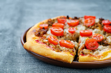 pizza with meat, mozzarella and tomatoes