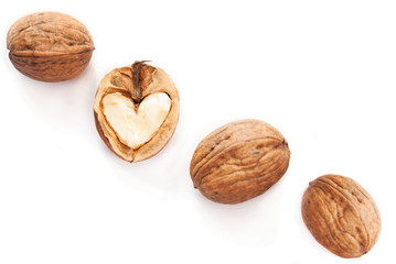 Heart in walnut on white background