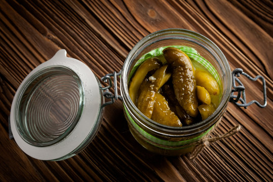 Natural diy pickles with chilli and garlic in a jar