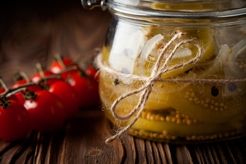 Natural diy marinated green tomatoes in a jar