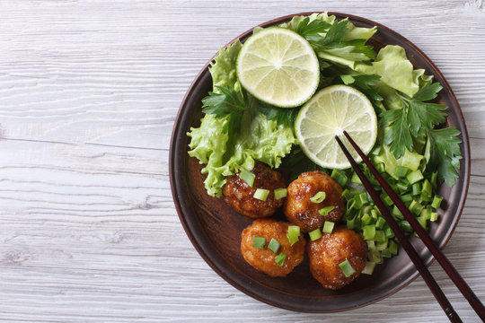 Fish balls in curry sauce on a plate top view of a horizontal