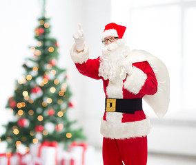man in costume of santa claus with bag