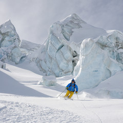 Skiing between seracs in Glacier - Stock Image - 74050450