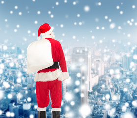 man in costume of santa claus with bag