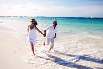 Couple running on the beach