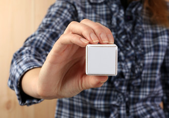 Educational cubes in hands, close-up