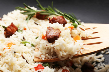 Tasty rice preparing in wok, close-up