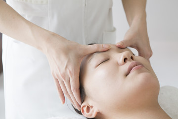 Fototapeta na wymiar Women undergoing massage of face