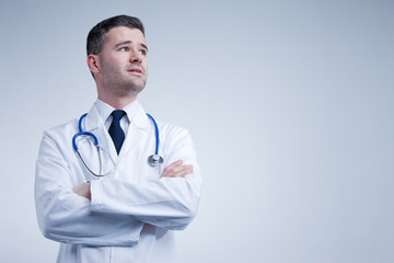 doctor looking up thinking or worried