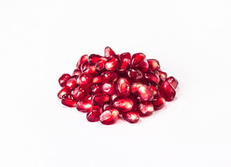 pile of pomegranate seeds isolated on white background