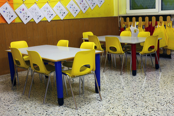 classroom of a nursery with the little yellow chairs