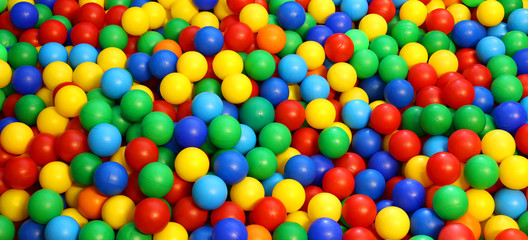 Fototapeta na wymiar colored plastic ball in the game pool