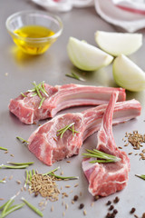 Raw lamb cutlets and spices