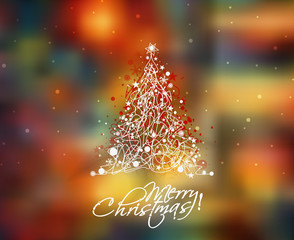 Christmas tree in the blur background with space for text