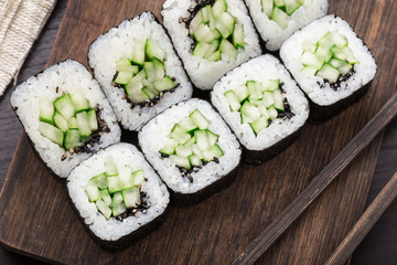 Sushi rolls with cucumber and sesame seed