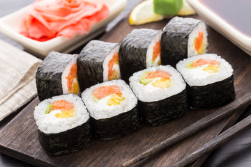 Sushi rolls with salmon and vegetables - 74064486
