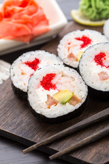 Sushi rolls with tobiko and shrimps