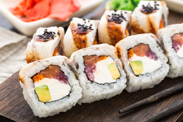 Sushi roll with salmon, tuna and eel