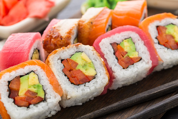 Rainbow sushi roll with salmon, tuna and eel