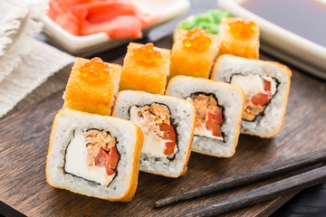 Fried sushi roll with salmon teriyaki