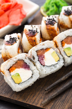 Sushi roll with salmon, tuna and eel