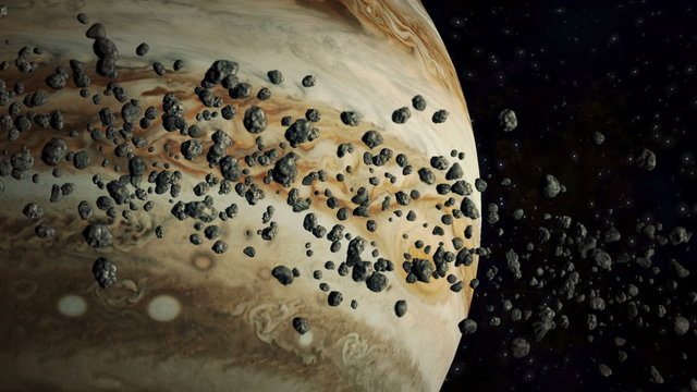 Asteroid in space flying around jupiter