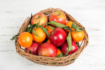 basket of apples and mandarins