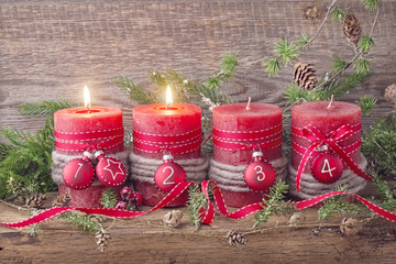 Four red christmas candle