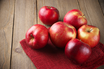 Red apples on napkin