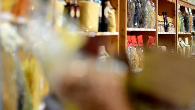 colourful pasta in bags in shelf - shop