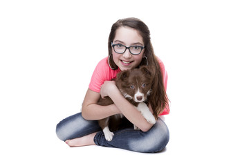 Obraz na płótnie Canvas Girl with a border collie puppy dog